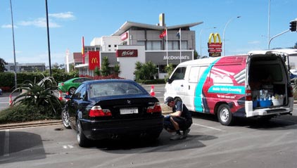 Valet cleaning the wheel of a car